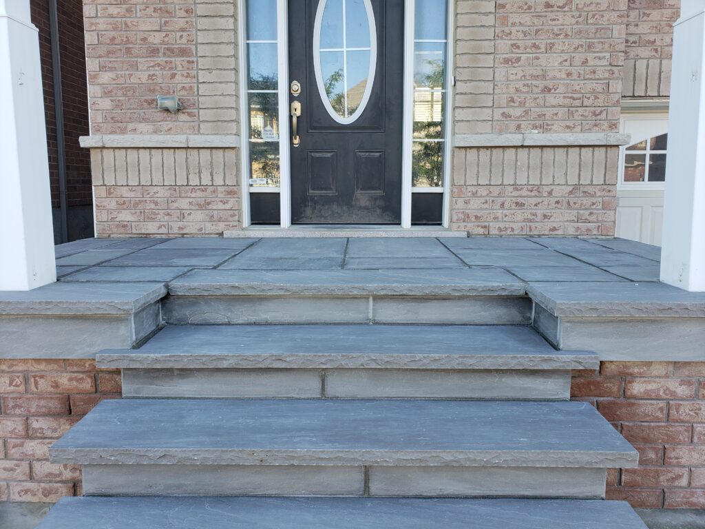 Porch adorned with Banas Slate Grey coping and flagstone for a modern look in Aurora, Richmond Hill, Vaughan, Stouffville, Oakville