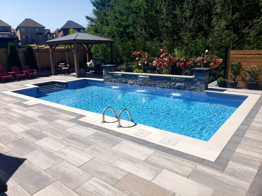 Backyard interlocking and custom waterfall in Aurora, stouffville, Richmond hill and Newmarket and oakville
