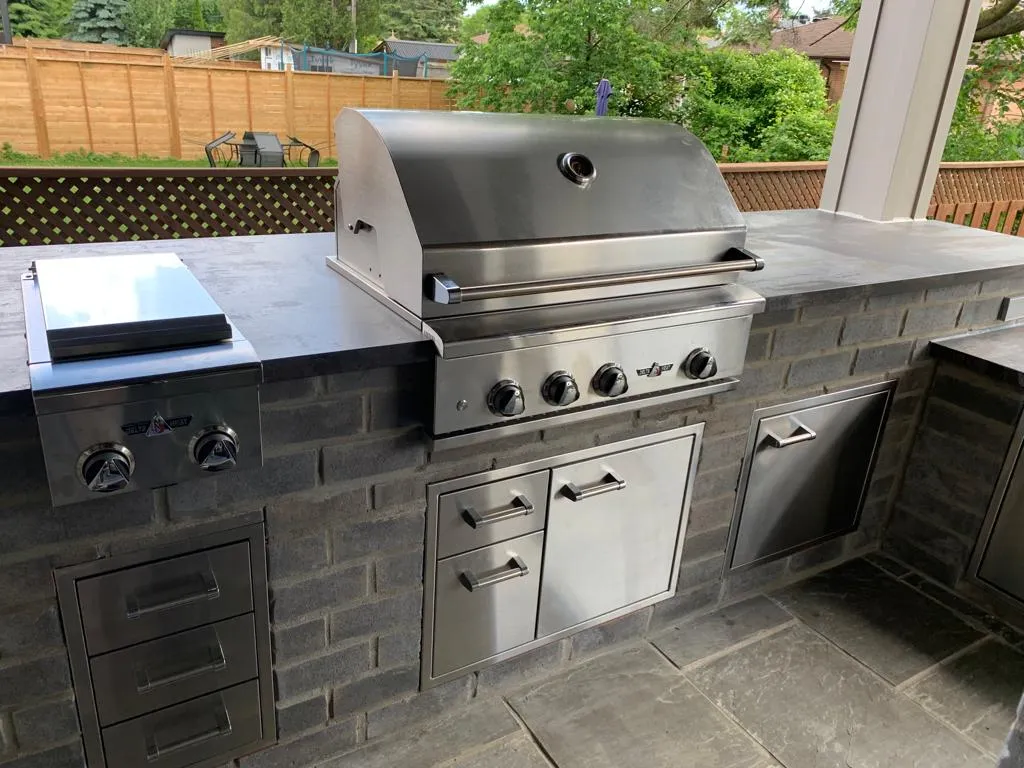 Custom outdoor kitchen and stone barbecue designed by Premier Masonry in Richmond Hill Ontario
